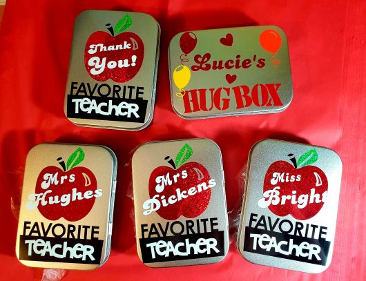 various teacher tins
